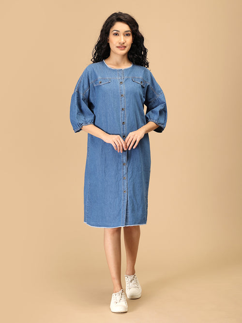 Button-front chambray utility dress for women with knee-length cut and casual sneakers.