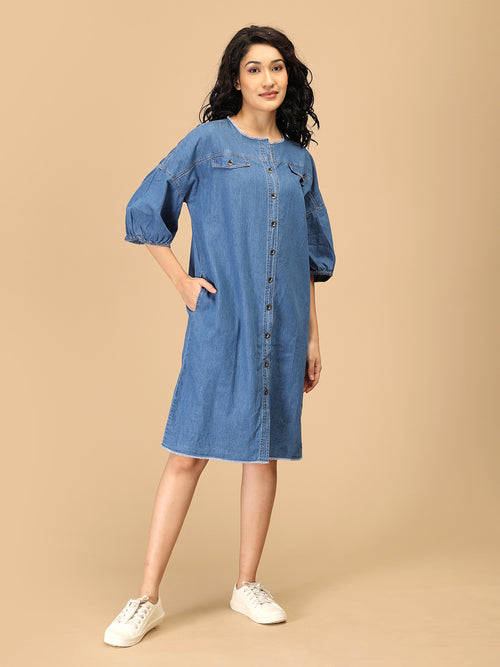 Women’s chambray button-down utility dress with front pockets and balloon sleeves.